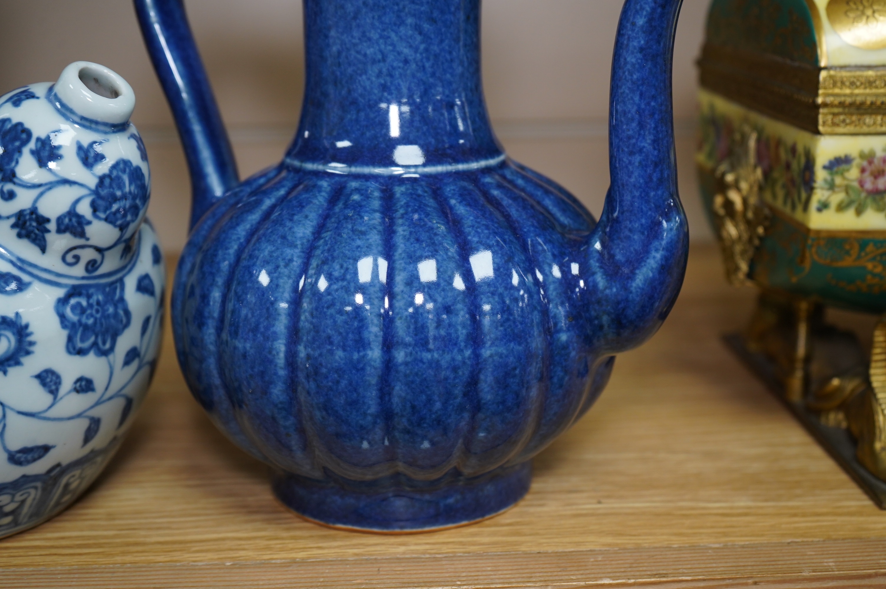 A Chinese porcelain powder blue ewer with cover and a similar blue and white example, largest 25cm high. Condition - good